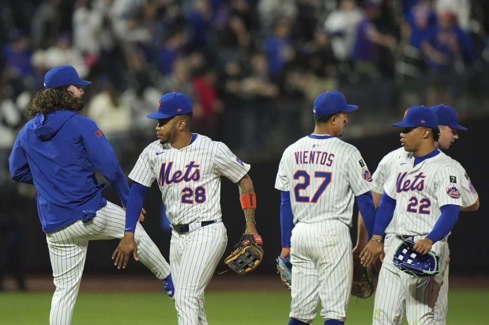 New York Mets' Juan Soto (22), Mark Vientos (27) and José Azocar (28) celebrate with teammates after a baseball game against the Arizona Diamondbacks Tuesday, April 29, 2025, in New York. (AP Photo/Frank Franklin II)