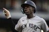 New York Yankees' Jazz Chisholm Jr. reacts after hitting a sacrifice that scored Aaron Judge during the sixth inning of a baseball game, Tuesday, April 22, 2025, in Cleveland. (AP Photo/David Dermer)