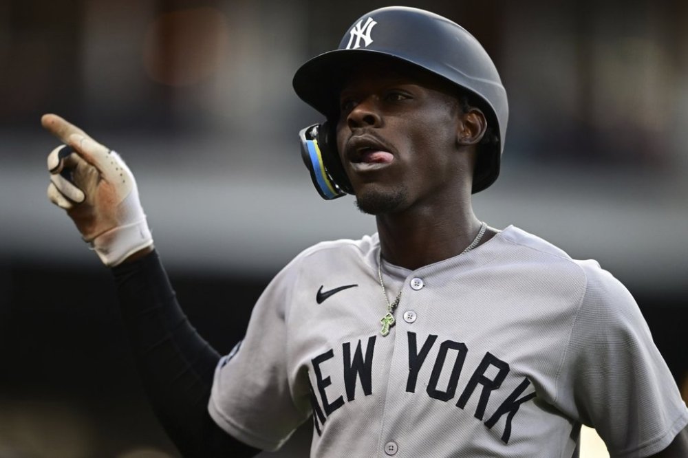 New York Yankees' Jazz Chisholm Jr. reacts after hitting a sacrifice that scored Aaron Judge during the sixth inning of a baseball game, Tuesday, April 22, 2025, in Cleveland. (AP Photo/David Dermer)