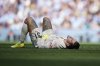Manchester City's goalkeeper Ederson grimaces in pain during the English Premier League soccer match between Manchester City and Crystal Palace at the Etihad stadium in Manchester, England, Saturday, April 12, 2025. (AP Photo/Dave Thompson)