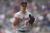 Detroit Tigers starting pitcher Jackson Jobe (21) claps while walking back to the dugout after completing the bottom of the first inning of a baseball game against the Minnesota Twins, Saturday, April 12, 2025, in Minneapolis. (AP Photo/Abbie Parr)