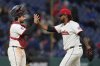 Cleveland Guardians catcher Austin Hedges, left, and relief pitcher Emmanuel Clase, right, celebrate after the Guardians defeated the Chicago White Sox in a baseball game in Cleveland, Wednesday, April 9, 2025. (AP Photo/Sue Ogrocki)