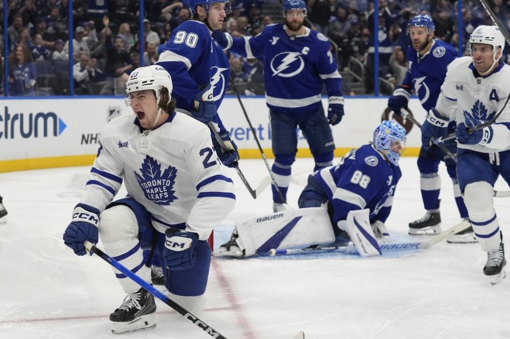 Toronto Maple Leafs left wing Matthew Knies (23) celebrates afrter scoring past Tampa Bay Lightning goaltender Andrei Vasilevskiy (88) during the third period of an NHL hockey game Wednesday, April 9, 2025, in Tampa, Fla. (AP Photo/Chris O'Meara)