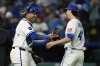 Kansas City Royals catcher Salvador Perez, left, and relief pitcher Daniel Lynch IV celebrate after their baseball game against the Minnesota Twins, Tuesday, April 8, 2025, in Kansas City, Mo. (AP Photo/Charlie Riedel)