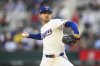 Texas Rangers pitcher Tyler Mahle throws to the Los Angeles Angels in the first inning of a baseball game, Tuesday, April 15, 2025, Arlington, Texas. (AP Photo/Albert Pena)