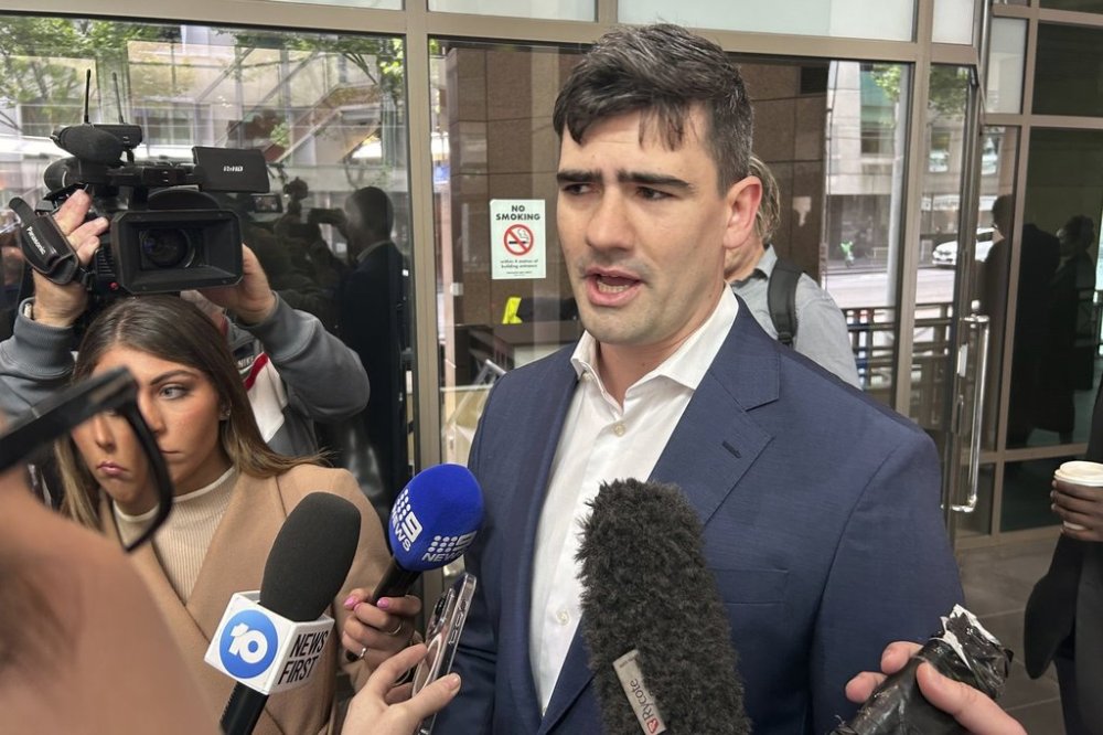 FILE - Jacob Hersant speaks outside the Melbourne Magistrates' Court in Melbourne, Australia, on Nov. 8, 2024, before his is sentenced after he was convicted for performing the Nazi salute. (AP Photo/Rod McGuirk, FILE)