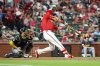 St. Louis Cardinals' Lars Nootbaar, right, hits an RBI single during the fifth inning of a baseball game against the Milwaukee Brewers, Friday, April 25, 2025, in St. Louis. (AP Photo/Scott Kane)