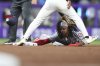 Washington Nationals shortstop CJ Abrams steals second during the third inning of a baseball game against the Miami Marlins, Friday, April 11, 2025, in Miami. (AP Photo/Lynne Sladky)
