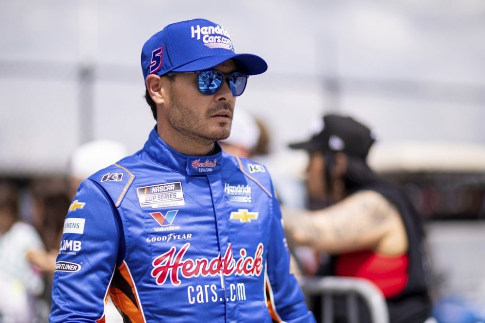 Driver Kyle Larson heads to the track before a NASCAR Cup Series auto race at Darlington Raceway, Sunday, April 6, 2025, in Darlington, S.C. (AP Photo/Scott Kinser)