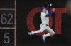 Kansas City Royals left fielder Mark Canha can't catch a double hit by Minnesota Twins' Harrison Bader during the fifth inning of a baseball game, Tuesday, April 8, 2025, in Kansas City, Mo. (AP Photo/Charlie Riedel)