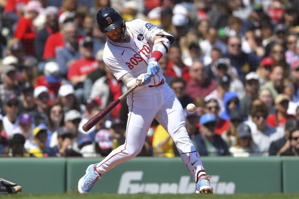 Boston Red Sox's Trevor Story hits a one-run single in the third inning of a baseball game against the Chicago White Sox, Monday, April 21, 2025, in Boston. (AP Photo/Steven Senne)