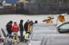 Investigators with the National Transportation Safety Board investigate the wreckage of a site seeing helicopter, Friday, April 11, 2025, that crashed into the Hudson River a day earlier in Jersey City, N.J. (AP Photo/Adam Hunger)