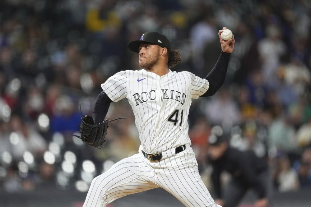 Colorado Rockies relief pitcher Luis Peralta works against the Milwaukee Brewers in the fifth inning of a baseball game Wednesday, April 9, 2025, in Denver. (AP Photo/David Zalubowski)