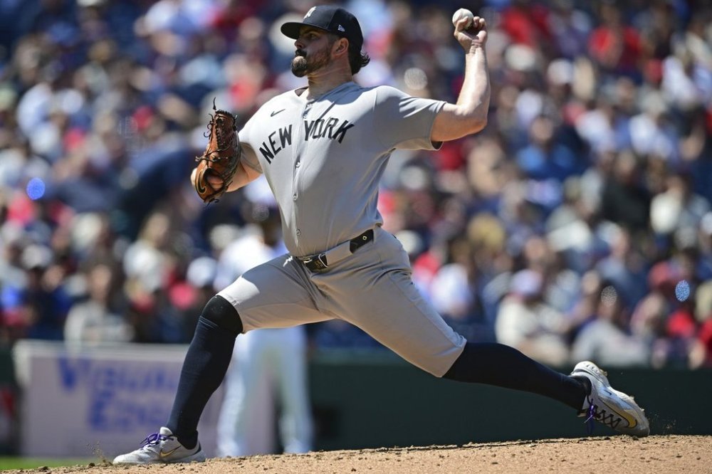 New York Yankees starting pitcher Carlos Rodon delivers during the fourth inning of a baseball game against the Cleveland Guardians, Wednesday, April 23, 2025, in Cleveland. (AP Photo/David Dermer)