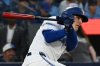 Toronto Blue Jays right-fielder Daulton Varsho (25) hits a single against the New York Mets during first inning MLB baseball action in Toronto on Tuesday Sept. 10, 2024. THE CANADIAN PRESS/Jon Blacker