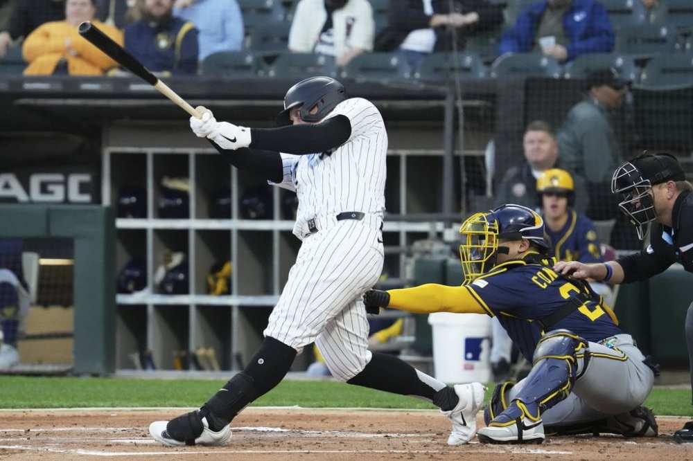 Chicago White Sox's Andrew Vaughn hits a single during the first inning of a baseball game against the Milwaukee Brewers in Chicago, Tuesday, April 29, 2025. (AP Photo/Nam Y. Huh)