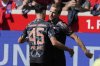 Bayern's Aleksandar Pavlovic and Harry Kane celebrate after a goal during the German Bundesliga soccer match between Heidenheim and Bayern Munich in Heidenheim, Germany, Saturday, April 19, 2025. (AP Photo/Matthias Schrader)