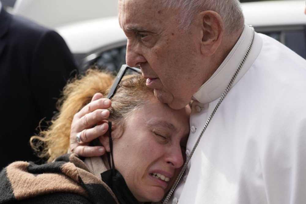 FILE - Pope Francis consoles Serena Subania who lost her daughter Angelica, 5 years old, the day before, as he leaves the Agostino Gemelli University Hospital in Rome, Saturday, April 1, 2023 after receiving treatment for a bronchitis. (AP Photo/Gregorio Borgia, File)