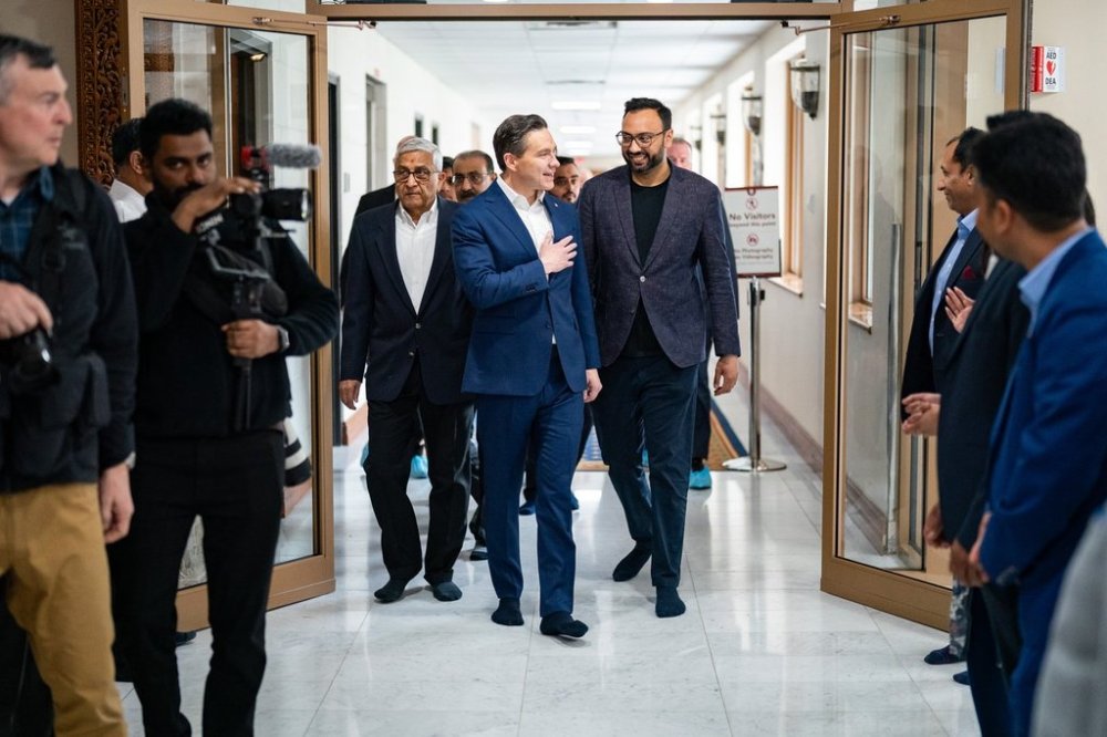 Conservative Party Leader Pierre Poilievre greets supporters as he visits BAPS Shri Swaminarayan Mandir Hindu Temple, in Toronto, Friday, April 18, 2025. THE CANADIAN PRESS/Arlyn McAdorey