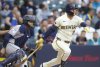Milwaukee Brewers' Brice Turang watches his double against the Houston Astros during the first inning of a baseball game, Tuesday, May 6, 2025, in Milwaukee. (AP Photo/Jeffrey Phelps)