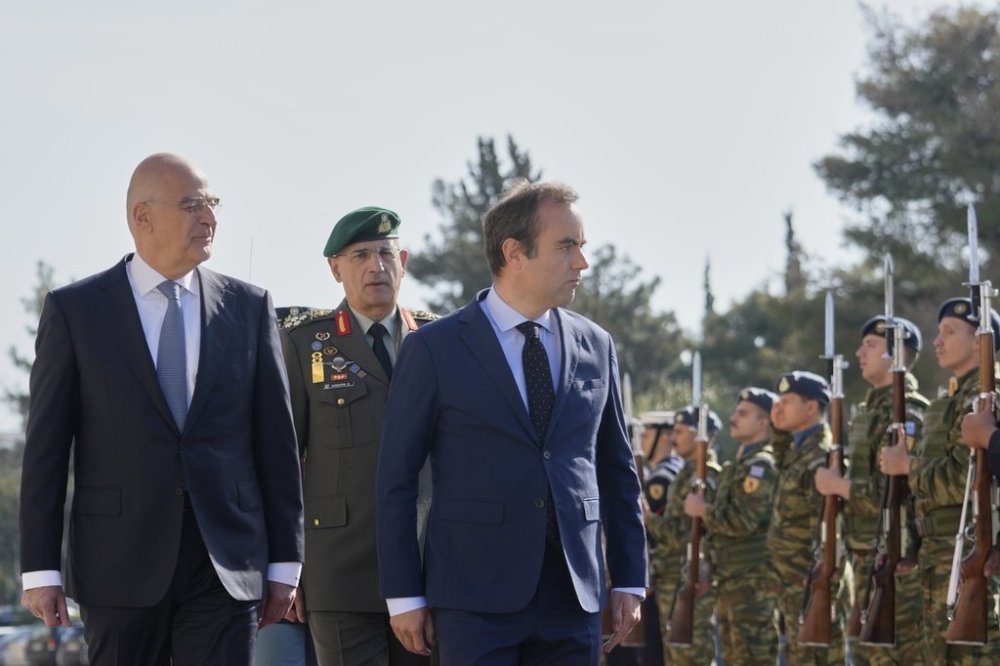 Greek Defense Minister Nikos Dendias, front left, and his French counterpart Sebastien Lecornu, front right, inspect the guard of honour before their meeting in Athens, Greece, Monday, April 14, 2025. (AP Photo/Petros Giannakouris)