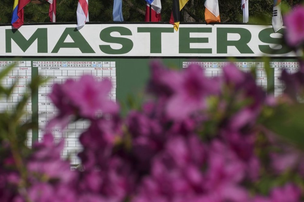 Azaleas are seen in front of the main scoreboard during a practice around at the Masters golf tournament, Wednesday, April 9, 2025, in Augusta, Ga. (AP Photo/Matt Slocum)