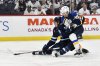 St. Louis Blues defenceman Cam Fowler (17) checks Jets forward Mark Scheifele (55) during second-period NHL playoff action in Winnipeg on Monday, April 21, 2025. THE CANADIAN PRESS/Fred Greenslade