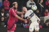St. Louis City's João Klauss, left, and Vancouver Whitecaps' Tate Johnson battle for the ball during the second half of an MLS soccer match Saturday, April 19, 2025, in St. Louis. (AP Photo/Jeff Roberson)