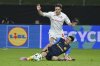 Celje's Juanjo Nieto is challenged by Fiorentina's Nicolo Fagioli, rear, during the Europa Conference League first-leg quarterfinal soccer match between Celje and Fiorentina in Celje, Slovenia, Thursday, April 10, 2025. (AP Photo/Igor Kupljenik)