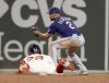 Texas Rangers second baseman Marcus Semien (2) tags out Boston Red Sox's Abraham Toro (29) during the fifth inning of a baseball game, Tuesday, May 6, 2025, in Boston. (AP Photo/Mark Stockwell)