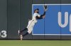 Minnesota Twins center fielder Byron Buxton (25) catches a fly out by Chicago White Sox's Andrew Benintendi (23) as the final out of a baseball game Tuesday, April 22, 2025, in Minneapolis. (AP Photo/Abbie Parr)