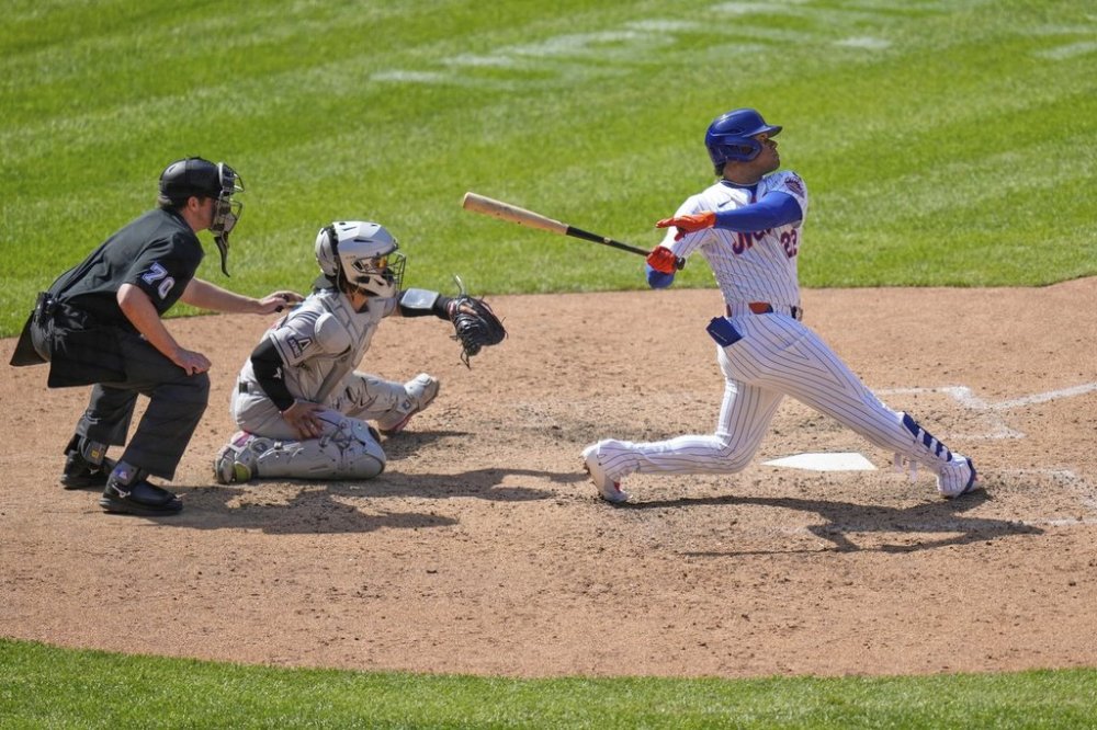 New York Mets' Juan Soto, right, watches his solo home run during the eighth inning of a baseball game against the Arizona Diamondbacks, Thursday, May 1, 2025, in New York. (AP Photo/Seth Wenig)