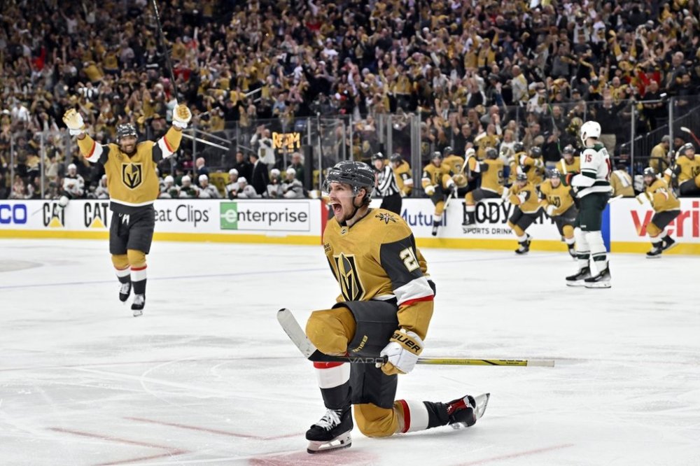Vegas Golden Knights center Brett Howden (21) reacts after scoring the winning goal against the Minnesota Wild during overtime of Game 5 of a first-round NHL hockey playoff series against the Minnesota Wild, Tuesday, April 29, 2025, in Las Vegas. (AP Photo/David Becker)