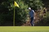 Scottie Scheffler celebrates after chipping in for birdie on the 12th hole during the second round at the Masters golf tournament, Friday, April 11, 2025, in Augusta, Ga. (AP Photo/Ashley Landis)