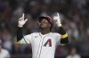 Arizona Diamondbacks' Geraldo Perdomo looks up as he arrives at home plate after hitting a home run against the Atlanta Braves during the fifth inning of a baseball game Sunday, April 27, 2025, in Phoenix. (AP Photo/Ross D. Franklin)