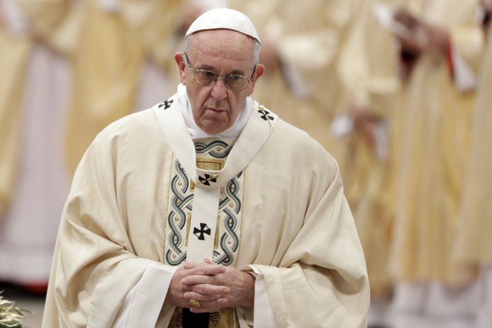 FILE - Pope Francis arrives to celebrate an Epiphany Mass in St. Peter's Basilica at the Vatican, Jan. 6, 2018. (AP Photo/Andrew Medichini, File)
