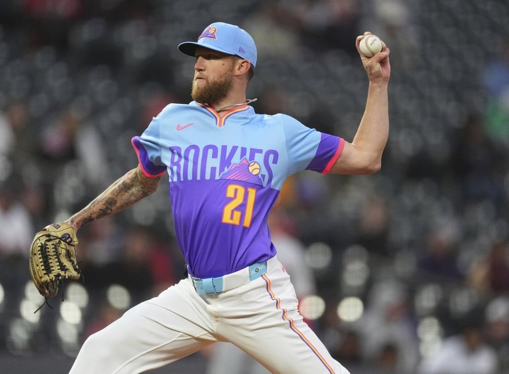 Colorado Rockies starting pitcher Kyle Freeland works against the Cincinnati Reds in the first inning of a baseball game Friday, April 25, 2025, in Denver. (AP Photo/David Zalubowski)