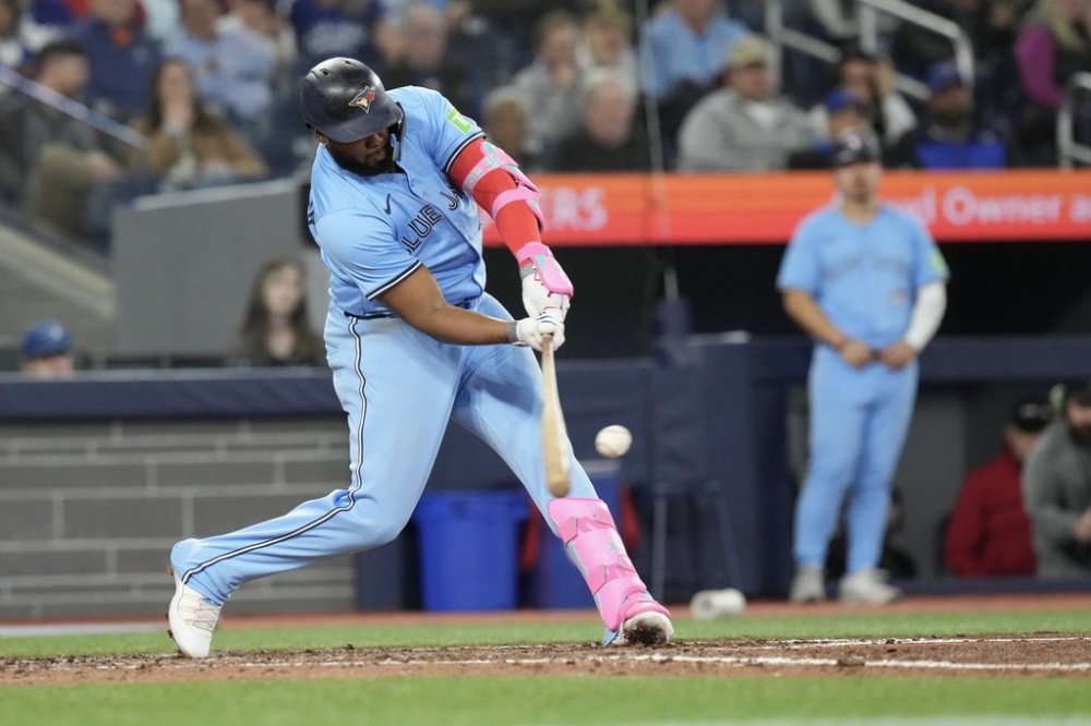Toronto Blue Jays' Vladimir Guerrero Jr. hits a three-run home run off Boston Red Sox pitcher Justin Slaten during eighth inning MLB baseball action in Toronto on Thursday May 1, 2025. THE CANADIAN PRESS/Chris Young