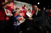 Liberal Leader Mark Carney shakes the hand of a young Oilers fan as he makes a campaign stop in Hamilton, Ont., on April 10, 2025. THE CANADIAN PRESS/Sean Kilpatrick