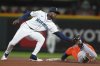 Seattle Mariners second baseman Ryan Bliss catches Houston Astros' Jake Meyers attempting to steal second base during the fifth inning of a baseball game Tuesday, April 8, 2025, in Seattle. (AP Photo/Lindsey Wasson)