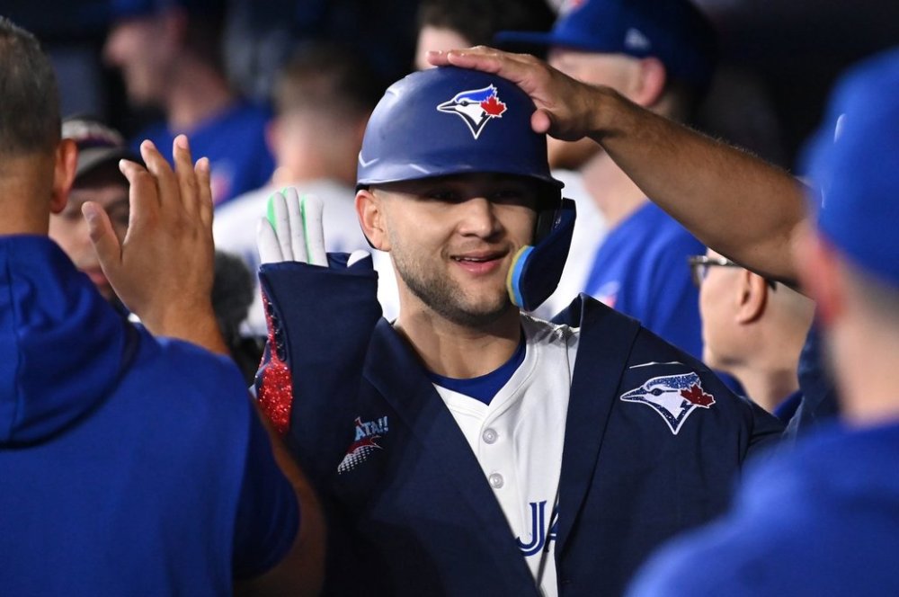 Toronto Blue Jays shortstop Bo Bichette (11) celebrates in the dugout after hitting a solo home run against the Cleveland Guardians in first inning American League baseball action in Toronto on Saturday, May 3, 2025. THE CANADIAN PRESS/Jon Blacker