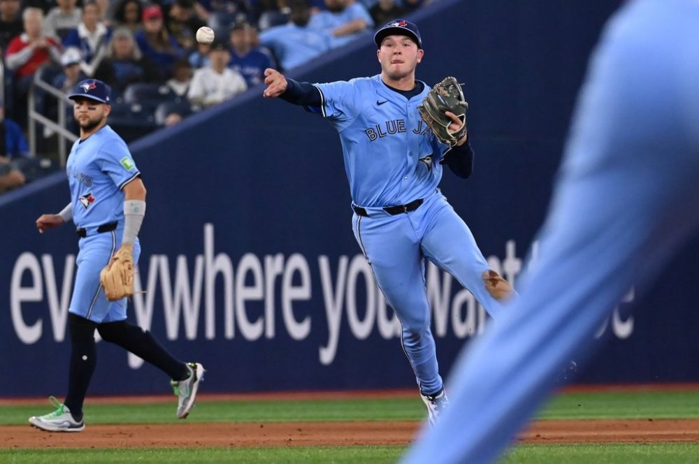 Toronto Blue Jays third baseman Will Wagner (7) throws to first base to put out Seattle Mariners third baseman Ben Williamson in fifth inning American League baseball action in Toronto on Sunday, April 20, 2025. THE CANADIAN PRESS/Jon Blacker