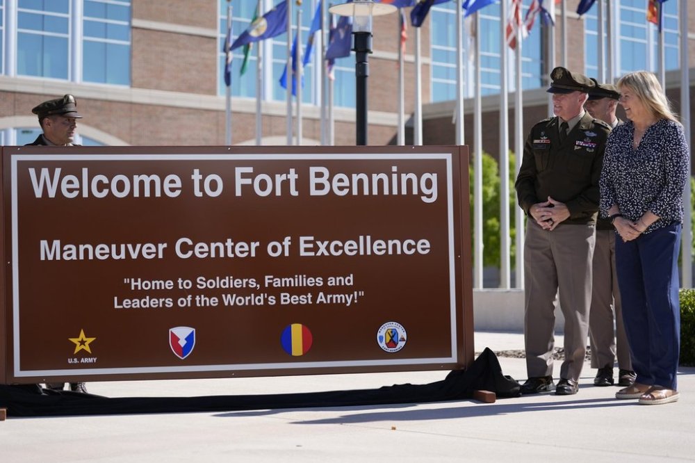 Ms. Sue Conger-Williams, right, Fred Benning's granddaughter unveils a new sign at Fort Benning during a ceremony honoring new namesake on Wednesday, April 16, 2025, in Fort Benning, Ga. (AP Photo/Brynn Anderson)