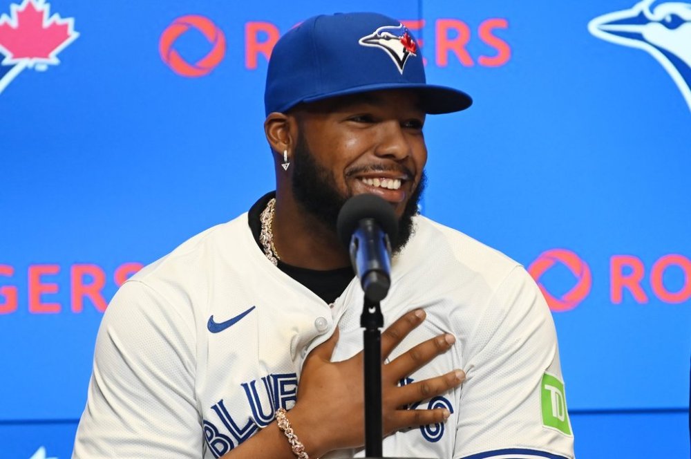 Toronto Blue Jays first baseman Vladimir Guerrero Jr. makes remarks in a press conference after signing his 14 year, $500 million dollar contract extension in Toronto on Monday April 14, 2025. THE CANADIAN PRESS/Jon Blacker