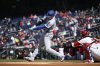 Los Angeles Dodgers Shohei Ohtani hits a single during the first inning of a baseball game against the Washington Nationals, Wednesday, April 9, 2025, in Washington. (AP Photo/John McDonnell)