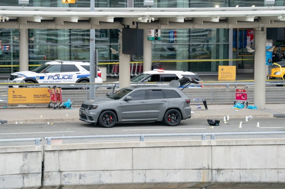 Evidence is pictured at the scene of police-involved shooting at the departures area of terminal 1 at Toronto Pearson International Airport, in Mississauga, Ont., on Thursday, April 24, 2025. THE CANADIAN PRESS/Arlyn McAdorey