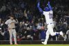 Chicago Cubs' Carson Kelly, right, celebrates as he rounds the bases after hitting a solo home run as San Francisco Giants third baseman Matt Chapman, left, reacts during the sixth inning of a baseball game in Chicago, Monday, May 5, 2025. (AP Photo/Nam Y. Huh)