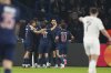 PSG players celebrate after Khvicha Kvaratskhelia scored their second goal during the Champions League quarterfinal first leg soccer match between Paris Saint-Germain and Aston Villa at Parc des Princes stadium in Paris, Wednesday, April 9, 2025. (AP Photo/Aurelien Morissard)