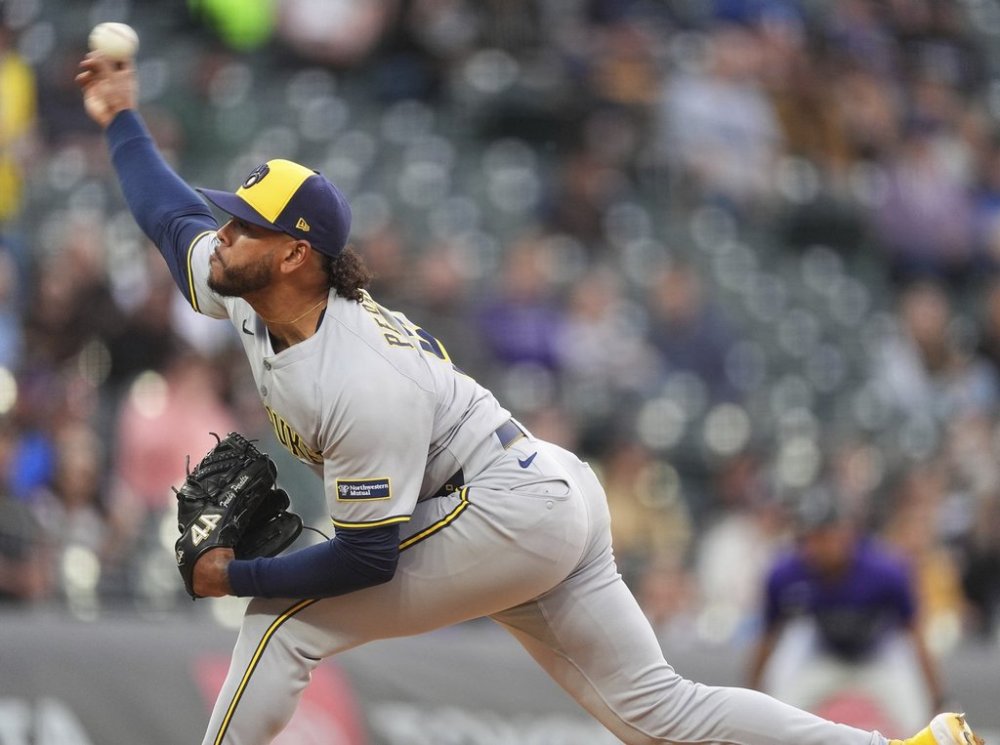 Milwaukee Brewers starting pitcher Freddy Peralta works against the Colorado Rockies in the first inning of a baseball game Tuesday, April 8, 2025, in Denver. (AP Photo/David Zalubowski)