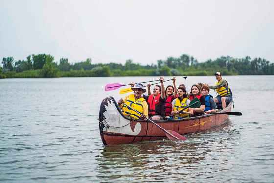 Nick Sikich, pictured at the front of the canoe, has volunteered at FortWhyte Alive since 2010. (Joseph Visser photo)